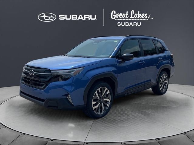 2026 Subaru FORESTER Touring Hybrid in Daybreak Blue Pearl — front three-quarter view