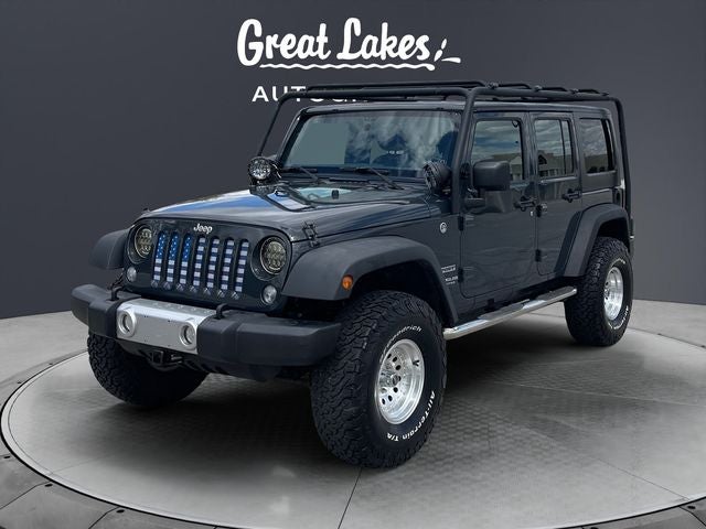 2017 Jeep Wrangler Unlimited Sport in Rhino Clearcoat — front three-quarter view