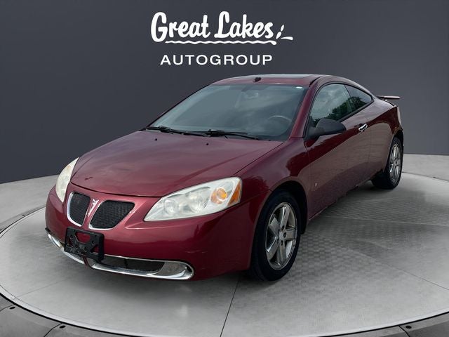 2009 Pontiac G6 GT in Performance Red Metallic — front three-quarter view