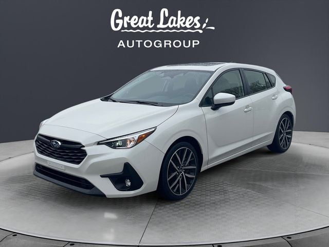 2024 Subaru Impreza Sport in Crystal White Pearl — front three-quarter view